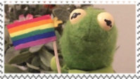 Kermit holding a gay pride flag